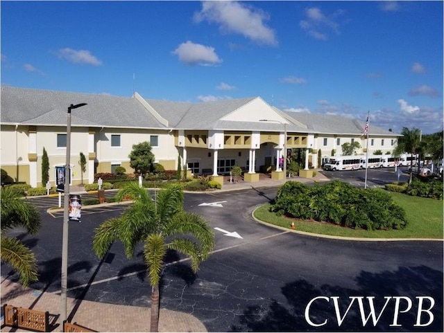 173 Kent J, West Palm Beach, FL 33417 - view of property featuring uncovered parking