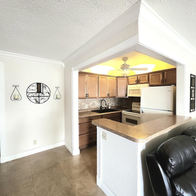 173 Kent J, West Palm Beach, FL 33417 - kitchen featuring white appliances, a sink, ornamental molding, decorative backsplash, and a textured ceiling