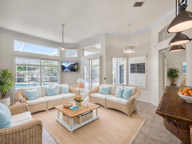 18771 Misty Lake Dr, Jupiter, FL 33458 - living area with light tile patterned flooring, crown molding, and a high ceiling