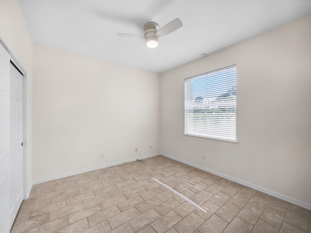 18771 Misty Lake Dr, Jupiter, FL 33458 - unfurnished bedroom with baseboards, a closet, and a ceiling fan