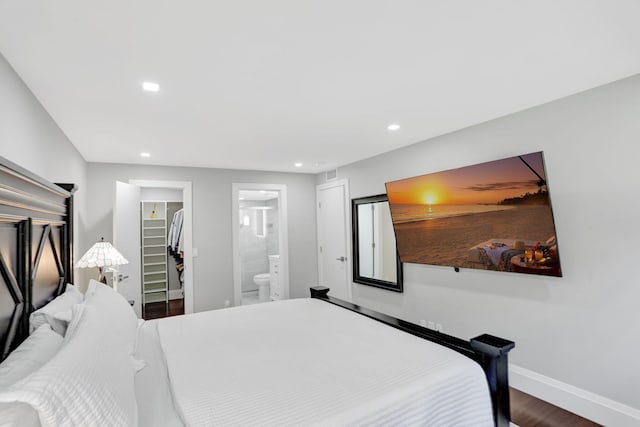 545 Trace Cir Unit 106, Deerfield Beach, FL 33441 - bedroom featuring a walk in closet, recessed lighting, baseboards, wood finished floors, and a closet