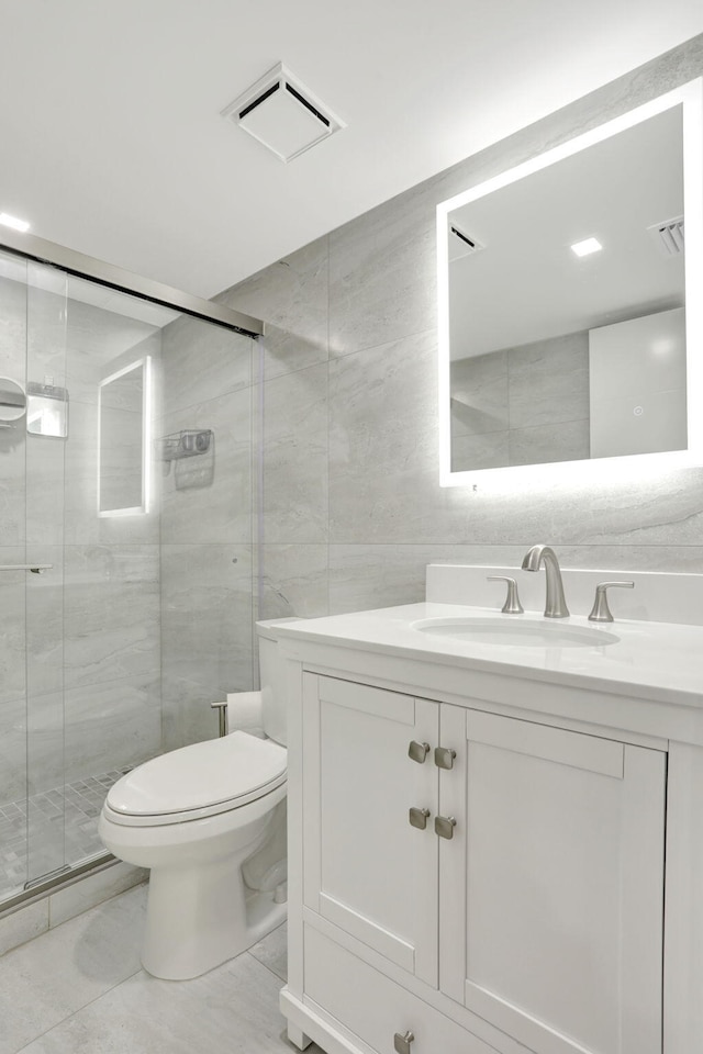 545 Trace Cir Unit 106, Deerfield Beach, FL 33441 - full bathroom with tile walls, toilet, a shower stall, and vanity