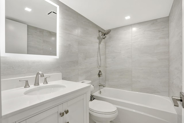 545 Trace Cir Unit 106, Deerfield Beach, FL 33441 - full bathroom featuring shower / bath combination, toilet, vanity, and tile walls