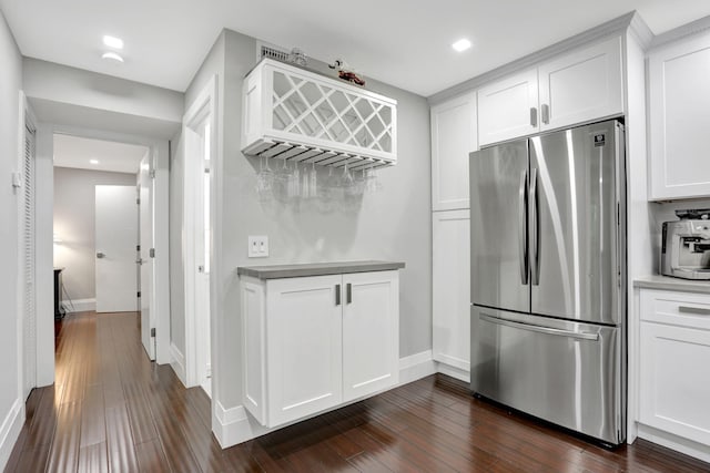 545 Trace Cir Unit 106, Deerfield Beach, FL 33441 - kitchen with freestanding refrigerator, white cabinets, dark wood finished floors, baseboards, and recessed lighting