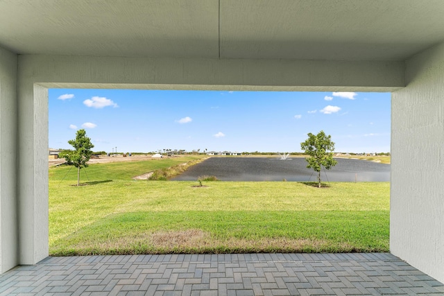 view of patio / terrace with a water view