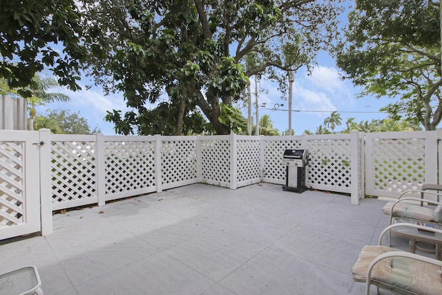 view of patio with a grill
