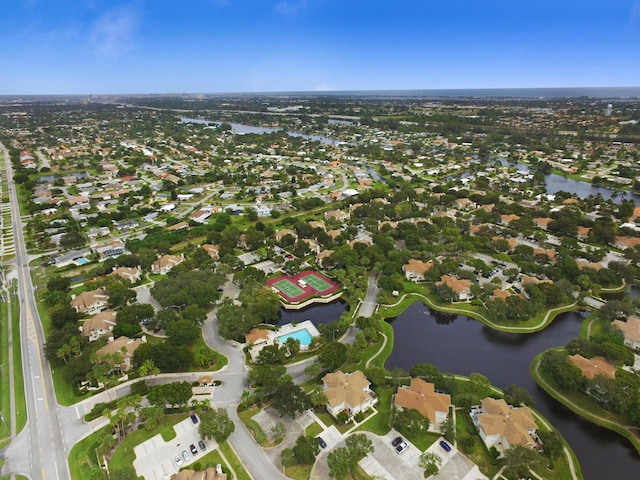 view of property location with a nearby body of water and nearby suburban area