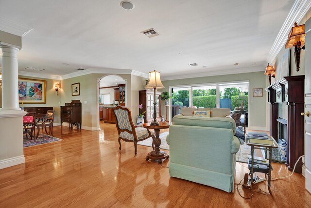 1360 SW Sugar Plum Dr, Boca Raton, FL 33486 - living room with ornate columns, wood finished floors, baseboards, and crown molding