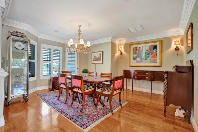 1360 SW Sugar Plum Dr, Boca Raton, FL 33486 - dining area featuring light wood-style floors, a chandelier, ornamental molding, and baseboards