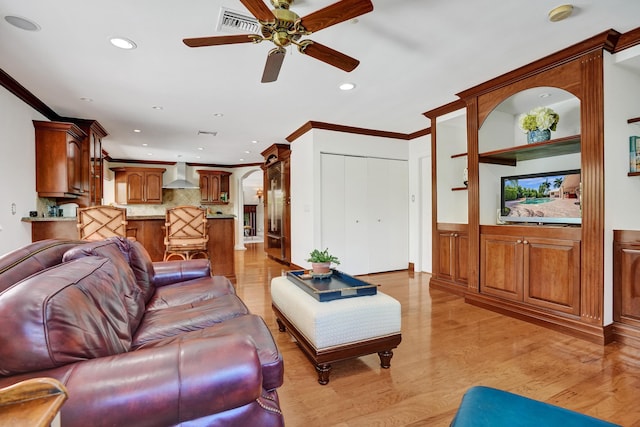 1360 SW Sugar Plum Dr, Boca Raton, FL 33486 - living area with ceiling fan, recessed lighting, ornamental molding, light wood-style flooring, and arched walkways