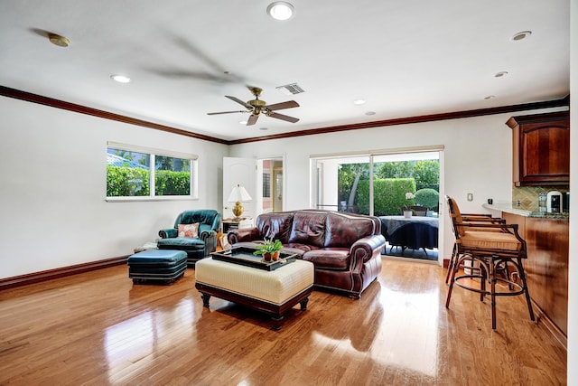 1360 SW Sugar Plum Dr, Boca Raton, FL 33486 - living area with crown molding, light wood finished floors, ceiling fan, recessed lighting, and baseboards