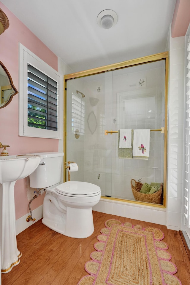 1360 SW Sugar Plum Dr, Boca Raton, FL 33486 - bathroom with toilet, wood finished floors, and a stall shower