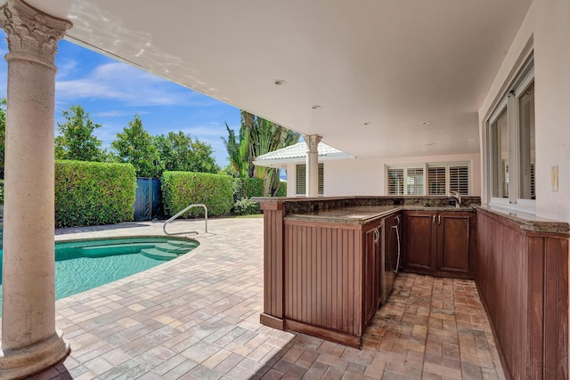 1360 SW Sugar Plum Dr, Boca Raton, FL 33486 - view of swimming pool featuring a patio area and an outdoor kitchen