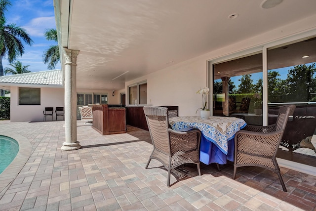 1360 SW Sugar Plum Dr, Boca Raton, FL 33486 - view of patio featuring outdoor dining area and a swimming pool