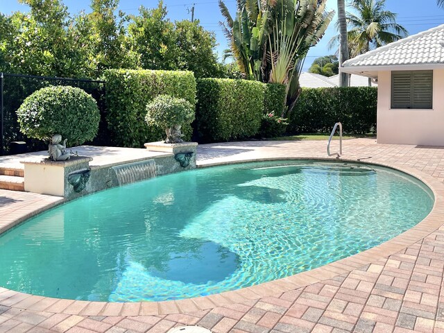 1360 SW Sugar Plum Dr, Boca Raton, FL 33486 - view of pool with fence and a patio