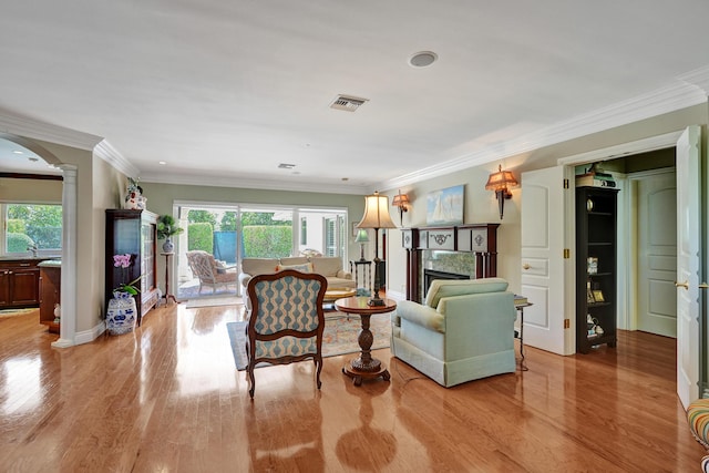 1360 SW Sugar Plum Dr, Boca Raton, FL 33486 - living room with plenty of natural light, ornate columns, wood finished floors, a fireplace, and ornamental molding