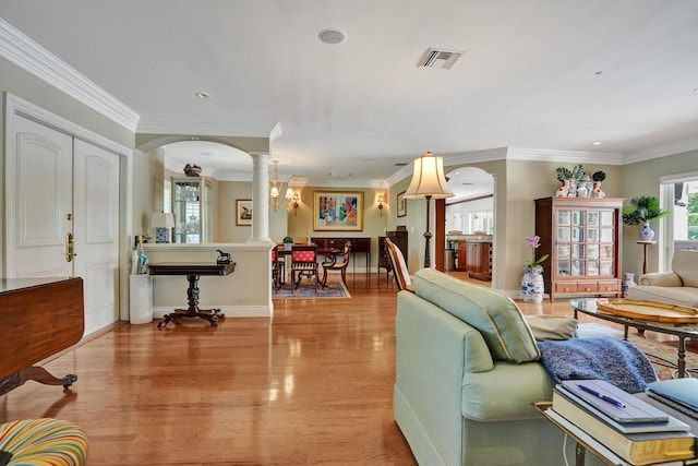 1360 SW Sugar Plum Dr, Boca Raton, FL 33486 - living area with ornate columns, arched walkways, crown molding, light wood-style floors, and recessed lighting