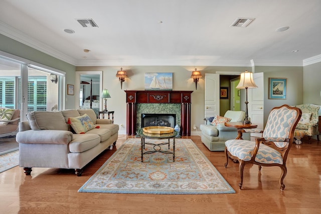 1360 SW Sugar Plum Dr, Boca Raton, FL 33486 - living area with crown molding, a premium fireplace, and wood finished floors