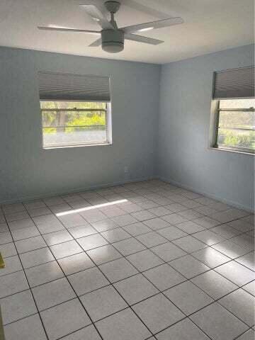 3566 N University Dr Unit F-5, Coral Springs, FL 33065 - spare room with healthy amount of natural light and a ceiling fan