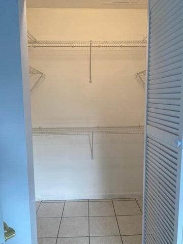 3566 N University Dr Unit F-5, Coral Springs, FL 33065 - spacious closet with tile patterned floors