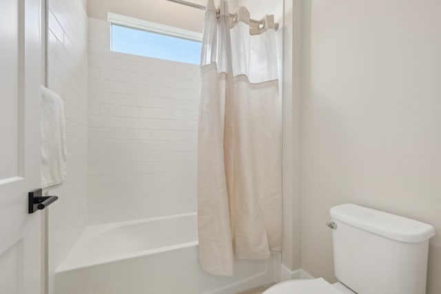 full bathroom with toilet and shower / bathtub combination with curtain