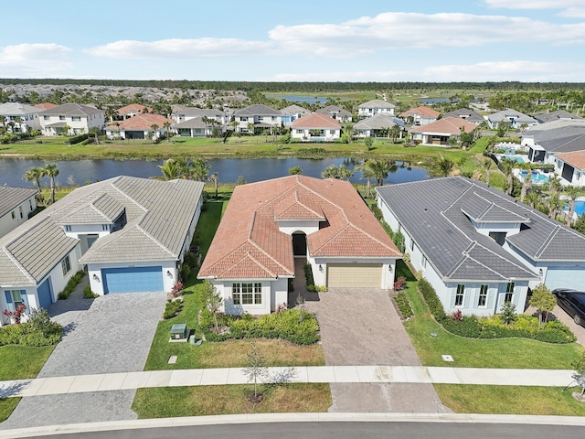 aerial perspective of suburban area with a nearby body of water
