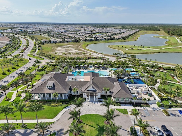 bird's eye view of a nearby body of water and a pool