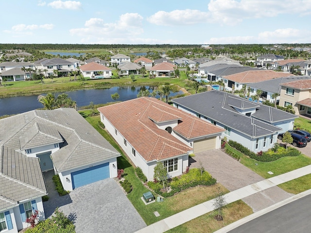 aerial perspective of suburban area with a nearby body of water