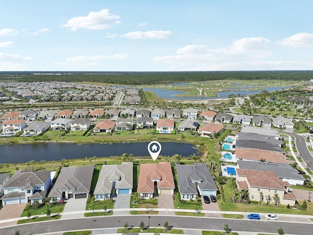 view of property location featuring nearby suburban area and a large body of water