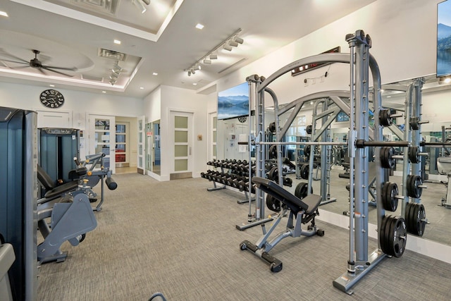 exercise room featuring ceiling fan, carpet, track lighting, recessed lighting, and french doors