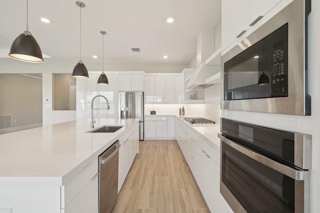 kitchen with modern cabinets, a sink, stainless steel appliances, white cabinets, and open shelves