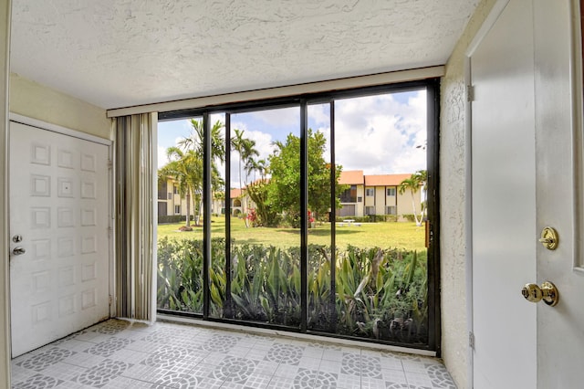 entryway with a textured ceiling