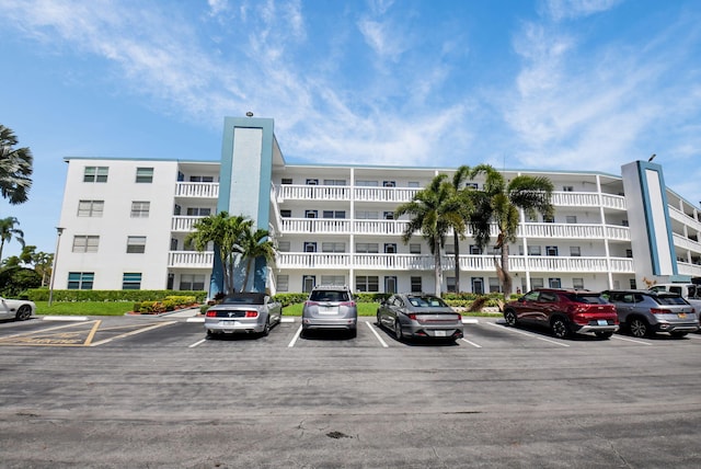 4088 Exeter E, Boca Raton, FL 33434 - view of apartment building / complex featuring uncovered parking