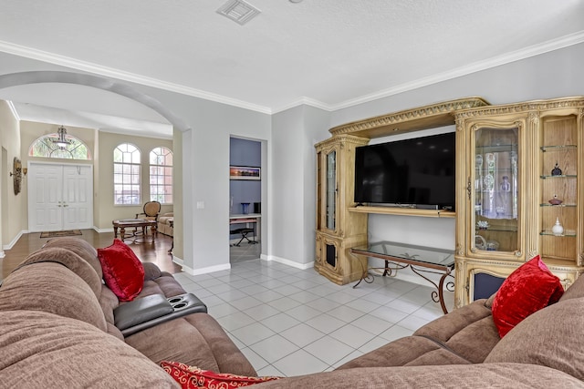 1741 Annandale Cir, Royal Palm Beach, FL 33411 - tiled living room featuring arched walkways, crown molding, and baseboards