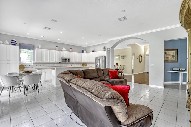 1741 Annandale Cir, Royal Palm Beach, FL 33411 - living room with arched walkways, light tile patterned floors, crown molding, and recessed lighting