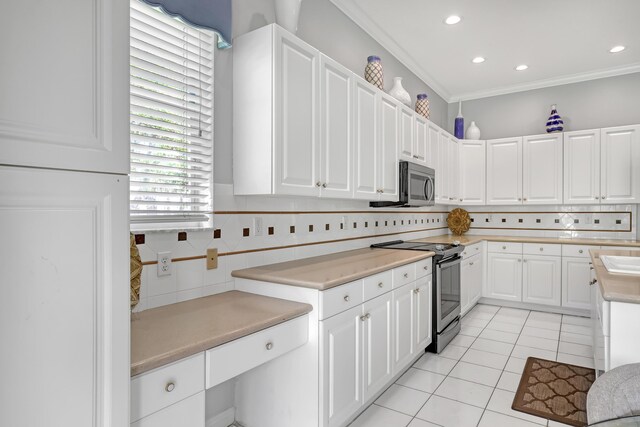1741 Annandale Cir, Royal Palm Beach, FL 33411 - kitchen with stainless steel appliances, light tile patterned flooring, white cabinets, light countertops, and recessed lighting