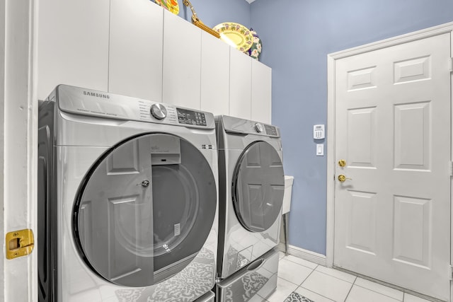 1741 Annandale Cir, Royal Palm Beach, FL 33411 - laundry room with washer and dryer, cabinet space, light tile patterned floors, and baseboards