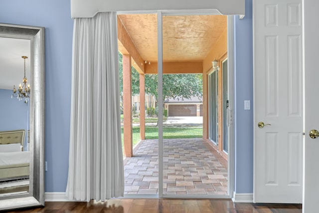 1741 Annandale Cir, Royal Palm Beach, FL 33411 - doorway to outside featuring a chandelier, plenty of natural light, and baseboards