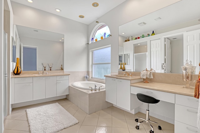 1741 Annandale Cir, Royal Palm Beach, FL 33411 - bathroom featuring a garden tub, two vanities, tile patterned floors, a high ceiling, and recessed lighting