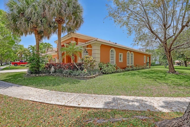 1741 Annandale Cir, Royal Palm Beach, FL 33411 - view of front of home with stucco siding and a front yard