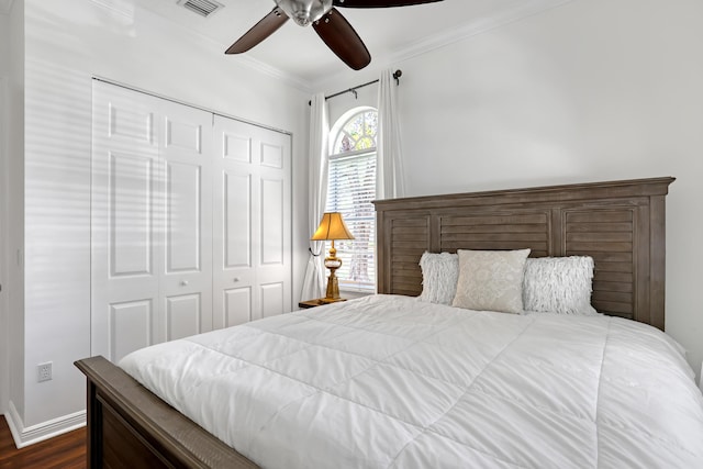 1741 Annandale Cir, Royal Palm Beach, FL 33411 - bedroom with a closet, dark wood-type flooring, ornamental molding, a ceiling fan, and baseboards