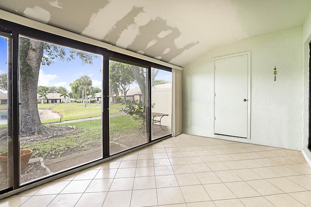 1017 Green Pine Blvd E, West Palm Beach, FL 33409 - unfurnished sunroom with vaulted ceiling and a residential view
