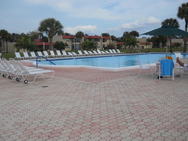 community pool featuring a patio area