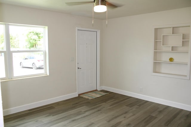3264 Ocean Pkwy, Boynton Beach, FL 33435 - unfurnished room with wood finished floors, a ceiling fan, and baseboards