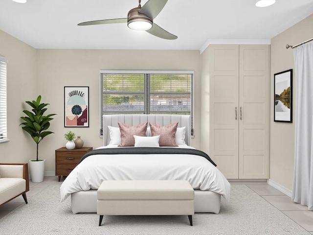 2710 SW 6th St SW, Boynton Beach, FL 33435 - bedroom with light tile patterned floors, baseboards, ceiling fan, and a closet