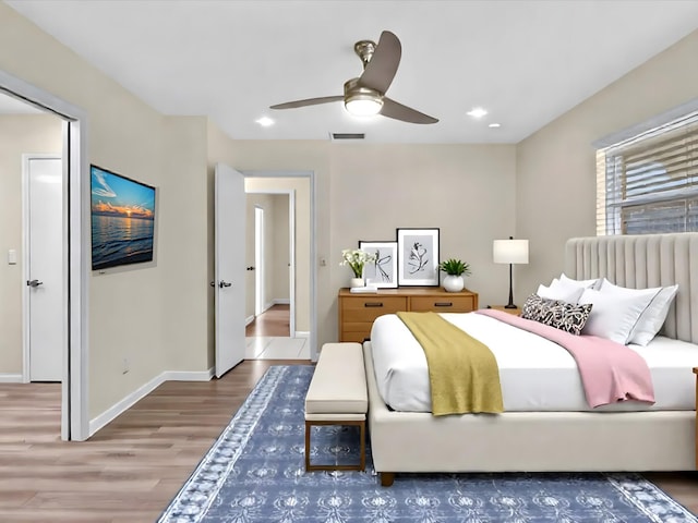 2710 SW 6th St SW, Boynton Beach, FL 33435 - bedroom with wood finished floors, baseboards, ceiling fan, and recessed lighting