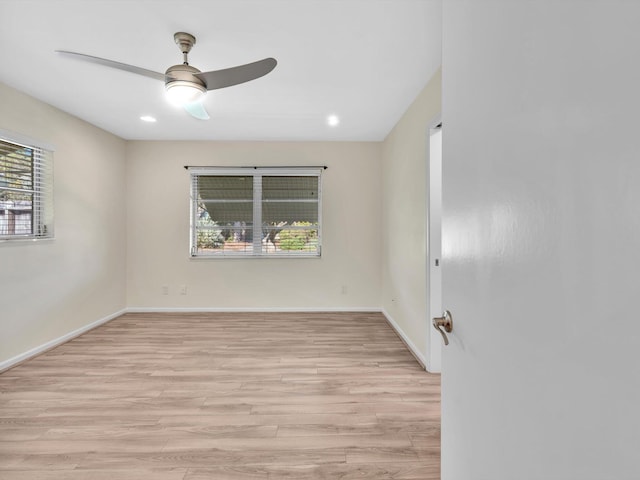 2710 SW 6th St SW, Boynton Beach, FL 33435 - empty room with healthy amount of natural light, light wood finished floors, a ceiling fan, baseboards, and recessed lighting