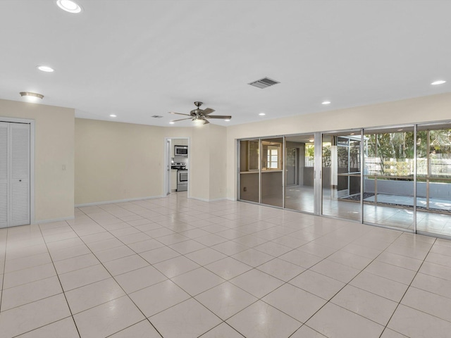 2710 SW 6th St SW, Boynton Beach, FL 33435 - empty room with recessed lighting, ceiling fan, baseboards, and light tile patterned floors