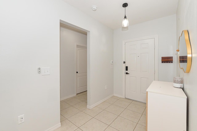 1222 SW Granadeer St, Port Saint Lucie, FL 34983 - foyer featuring light tile patterned floors and baseboards