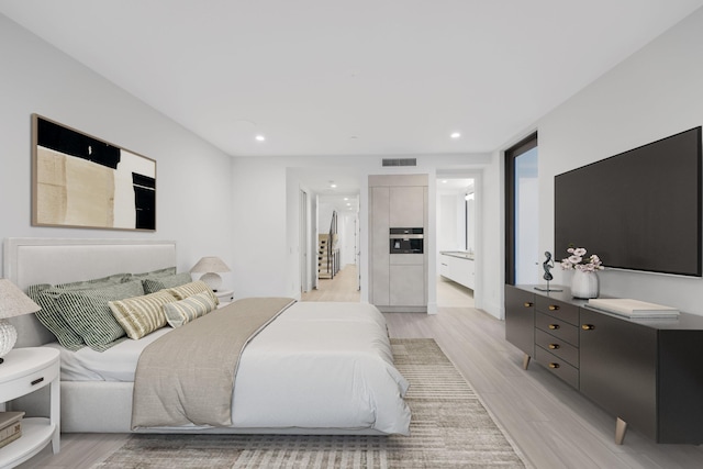 201 SE 4th Ave, Delray Beach, FL 33483 - bedroom with light wood-type flooring and recessed lighting